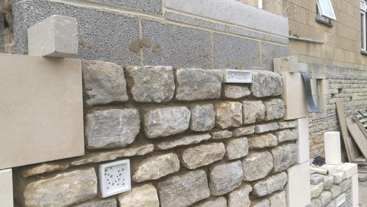 Bee Blocks in a stone wall